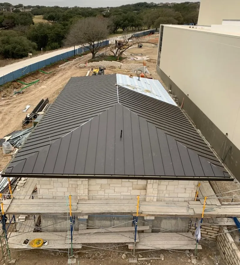 Metal roof new construction with scaffolding in Plano